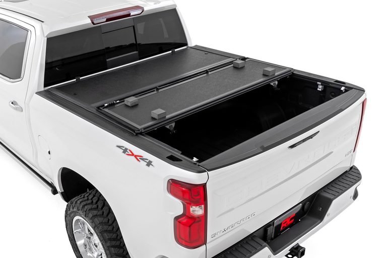 CAPSER HARD TRI-FOLD TONNEAU COVER — CHEVY SILVERADO/GMC SIERRA 1500